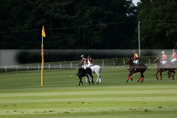 Four Quarters Black (black) v BHC (red) in a Autumn Cup polo match on Ambersham 2 at Cowdray Park Polo Club on Friday 20 September 2013 www.polopictures.co.uk