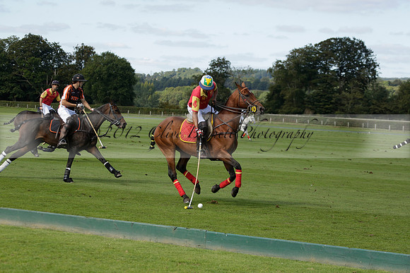 Four Quarters Black (black) v BHC (red) in a Autumn Cup polo match on Ambersham 2 at Cowdray Park Polo Club on Friday 20 September 2013 www.polopictures.co.uk