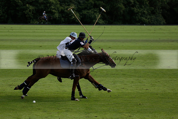 Pandas (white) v Home Farm (navy) in a Park House West Sussex Cup Polo match on Brooksfield at Cowdray Park Polo Club on Friday 30 August 2013. 2013.08.30 www.polopictures.co.uk