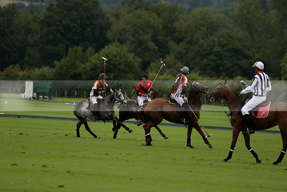 Four Quarters Black (black) v Clashleigh (red) in the Autumn Cup subsidiary final polo match on Ambersham 2 at Cowdray Park Polo Club on Sunday 22 September 2013 www.polopictures.co.uk