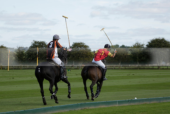 Four Quarters Black (black) v BHC (red) in a Autumn Cup polo match on Ambersham 2 at Cowdray Park Polo Club on Friday 20 September 2013 www.polopictures.co.uk
