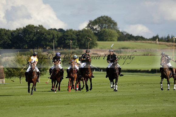 Aryana (black) v Shoreline (yellow) in a Farewell Cup polo match played on Ambersham 5 at Cowdray Park Polo Club on Wednesday 18 September 2013. www.polopictures.co.uk
