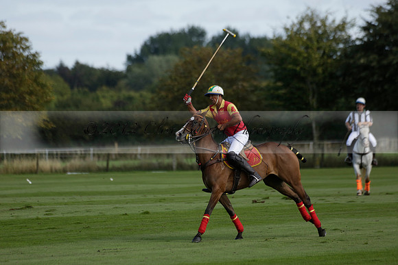 Four Quarters Black (black) v BHC (red) in a Autumn Cup polo match on Ambersham 2 at Cowdray Park Polo Club on Friday 20 September 2013 www.polopictures.co.uk