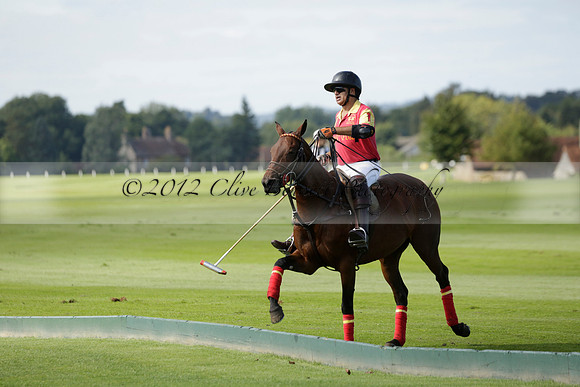 Four Quarters Black (black) v BHC (red) in a Autumn Cup polo match on Ambersham 2 at Cowdray Park Polo Club on Friday 20 September 2013 www.polopictures.co.uk