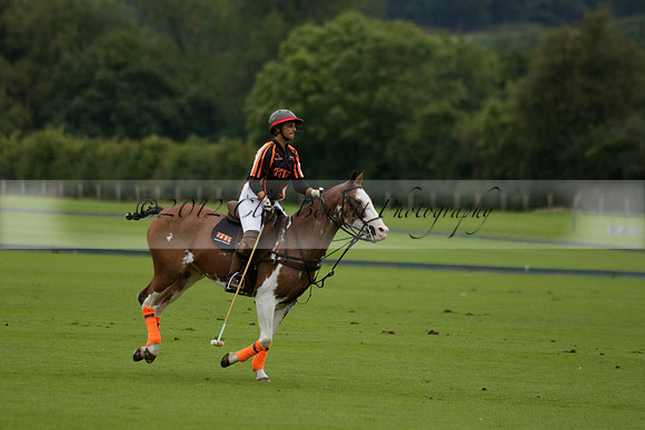 Four Quarters Black (black) v Clashleigh (red) in the Autumn Cup subsidiary final polo match on Ambersham 2 at Cowdray Park Polo Club on Sunday 22 September 2013 www.polopictures.co.uk