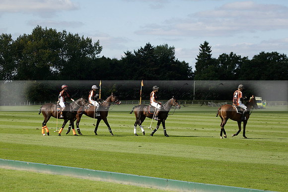 Four Quarters Black (black) v BHC (red) in a Autumn Cup polo match on Ambersham 2 at Cowdray Park Polo Club on Friday 20 September 2013 www.polopictures.co.uk