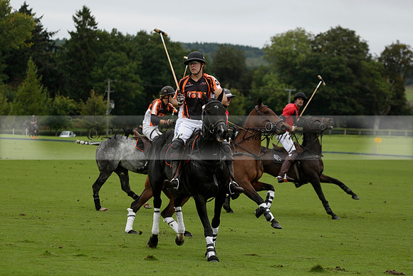 Four Quarters Black (black) v Clashleigh (red) in the Autumn Cup subsidiary final polo match on Ambersham 2 at Cowdray Park Polo Club on Sunday 22 September 2013 www.polopictures.co.uk