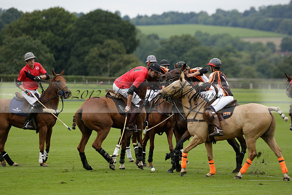 Four Quarters Black (black) v Clashleigh (red) in the Autumn Cup subsidiary final polo match on Ambersham 2 at Cowdray Park Polo Club on Sunday 22 September 2013 www.polopictures.co.uk