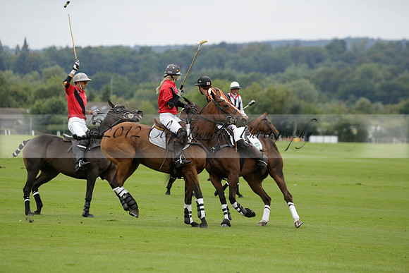 Four Quarters Black (black) v Clashleigh (red) in the Autumn Cup subsidiary final polo match on Ambersham 2 at Cowdray Park Polo Club on Sunday 22 September 2013 www.polopictures.co.uk