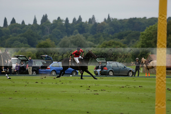 Four Quarters Black (black) v Clashleigh (red) in the Autumn Cup subsidiary final polo match on Ambersham 2 at Cowdray Park Polo Club on Sunday 22 September 2013 www.polopictures.co.uk