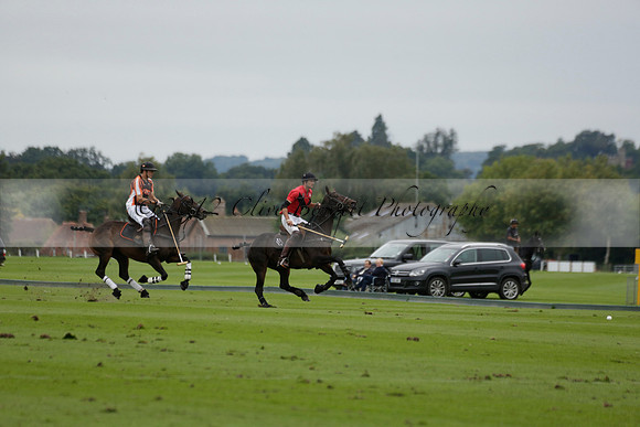 Four Quarters Black (black) v Clashleigh (red) in the Autumn Cup subsidiary final polo match on Ambersham 2 at Cowdray Park Polo Club on Sunday 22 September 2013 www.polopictures.co.uk
