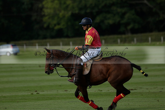 Four Quarters Black (black) v BHC (red) in a Autumn Cup polo match on Ambersham 2 at Cowdray Park Polo Club on Friday 20 September 2013 www.polopictures.co.uk