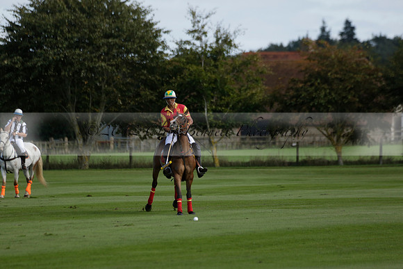 Four Quarters Black (black) v BHC (red) in a Autumn Cup polo match on Ambersham 2 at Cowdray Park Polo Club on Friday 20 September 2013 www.polopictures.co.uk