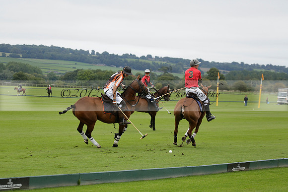 Four Quarters Black (black) v Clashleigh (red) in the Autumn Cup subsidiary final polo match on Ambersham 2 at Cowdray Park Polo Club on Sunday 22 September 2013 www.polopictures.co.uk