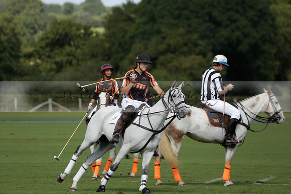 Four Quarters Black (black) v BHC (red) in a Autumn Cup polo match on Ambersham 2 at Cowdray Park Polo Club on Friday 20 September 2013 www.polopictures.co.uk