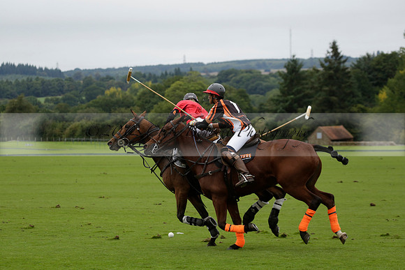 Four Quarters Black (black) v Clashleigh (red) in the Autumn Cup subsidiary final polo match on Ambersham 2 at Cowdray Park Polo Club on Sunday 22 September 2013 www.polopictures.co.uk
