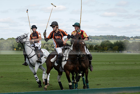 Four Quarters Black (black) v BHC (red) in a Autumn Cup polo match on Ambersham 2 at Cowdray Park Polo Club on Friday 20 September 2013 www.polopictures.co.uk