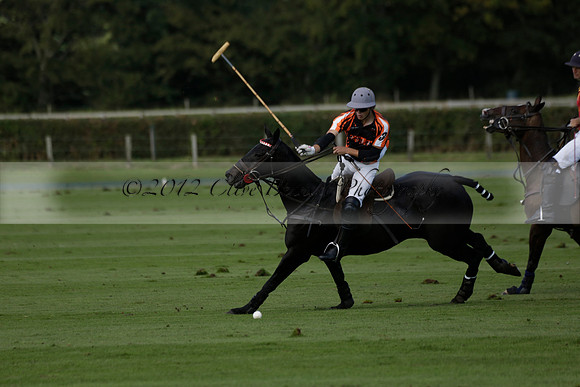 Four Quarters Black (black) v BHC (red) in a Autumn Cup polo match on Ambersham 2 at Cowdray Park Polo Club on Friday 20 September 2013 www.polopictures.co.uk