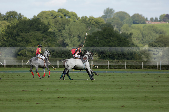 Four Quarters Black (black) v BHC (red) in a Autumn Cup polo match on Ambersham 2 at Cowdray Park Polo Club on Friday 20 September 2013 www.polopictures.co.uk