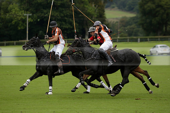 Four Quarters Black (black) v Clashleigh (red) in the Autumn Cup subsidiary final polo match on Ambersham 2 at Cowdray Park Polo Club on Sunday 22 September 2013 www.polopictures.co.uk
