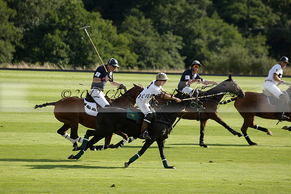 Pandas (white) v Home Farm (navy) in a Park House West Sussex Cup Polo match on Brooksfield at Cowdray Park Polo Club on Friday 30 August 2013. 2013.08.30 www.polopictures.co.uk