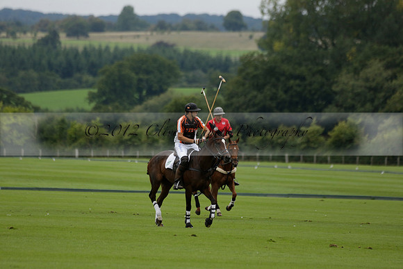 Four Quarters Black (black) v Clashleigh (red) in the Autumn Cup subsidiary final polo match on Ambersham 2 at Cowdray Park Polo Club on Sunday 22 September 2013 www.polopictures.co.uk