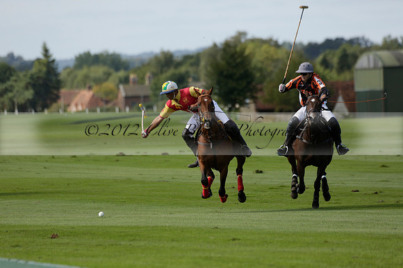 Four Quarters Black (black) v BHC (red) in a Autumn Cup polo match on Ambersham 2 at Cowdray Park Polo Club on Friday 20 September 2013 www.polopictures.co.uk