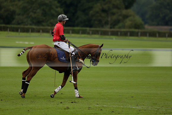 Four Quarters Black (black) v Clashleigh (red) in the Autumn Cup subsidiary final polo match on Ambersham 2 at Cowdray Park Polo Club on Sunday 22 September 2013 www.polopictures.co.uk