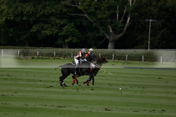 Four Quarters Black (black) v BHC (red) in a Autumn Cup polo match on Ambersham 2 at Cowdray Park Polo Club on Friday 20 September 2013 www.polopictures.co.uk