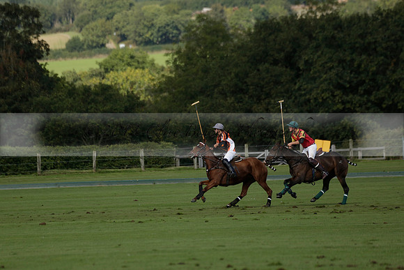 Four Quarters Black (black) v BHC (red) in a Autumn Cup polo match on Ambersham 2 at Cowdray Park Polo Club on Friday 20 September 2013 www.polopictures.co.uk