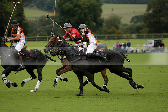 Four Quarters Black (black) v Clashleigh (red) in the Autumn Cup subsidiary final polo match on Ambersham 2 at Cowdray Park Polo Club on Sunday 22 September 2013 www.polopictures.co.uk