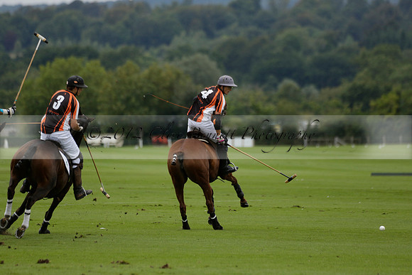 Four Quarters Black (black) v Clashleigh (red) in the Autumn Cup subsidiary final polo match on Ambersham 2 at Cowdray Park Polo Club on Sunday 22 September 2013 www.polopictures.co.uk