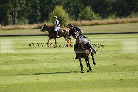 Pandas (white) v Home Farm (navy) in a Park House West Sussex Cup Polo match on Brooksfield at Cowdray Park Polo Club on Friday 30 August 2013. 2013.08.30 www.polopictures.co.uk