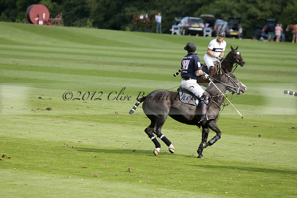 Pandas (white) v Home Farm (navy) in a Park House West Sussex Cup Polo match on Brooksfield at Cowdray Park Polo Club on Friday 30 August 2013. 2013.08.30 www.polopictures.co.uk