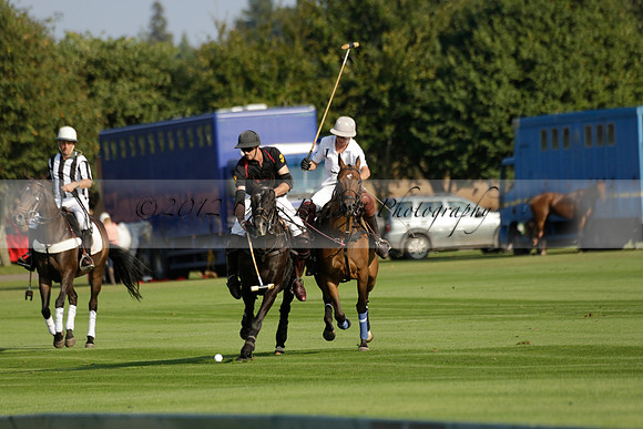 Pluma Negra (white) v Shoreline (black) in the Brecknock Cup Subsidiary final polo match played on Sunday 25 August 2013 at Cowdray Park Polo Club on Ambersham 1. 2013.10.12 www.polopictures.co.uk