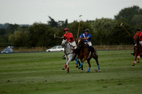 Ghost Chilli (blue) v Team Tonic (red) in a Lodsworth Cup Polo match on Ambersham 3 at Cowdray Park Polo Club on Friday 30 August 2013. 2013.08.30 www.polopictures.co.uk