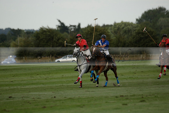 Ghost Chilli (blue) v Team Tonic (red) in a Lodsworth Cup Polo match on Ambersham 3 at Cowdray Park Polo Club on Friday 30 August 2013. 2013.08.30 www.polopictures.co.uk