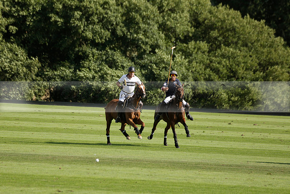 Pandas (white) v Home Farm (navy) in a Park House West Sussex Cup Polo match on Brooksfield at Cowdray Park Polo Club on Friday 30 August 2013. 2013.08.30 www.polopictures.co.uk