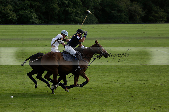 Pandas (white) v Home Farm (navy) in a Park House West Sussex Cup Polo match on Brooksfield at Cowdray Park Polo Club on Friday 30 August 2013. 2013.08.30 www.polopictures.co.uk