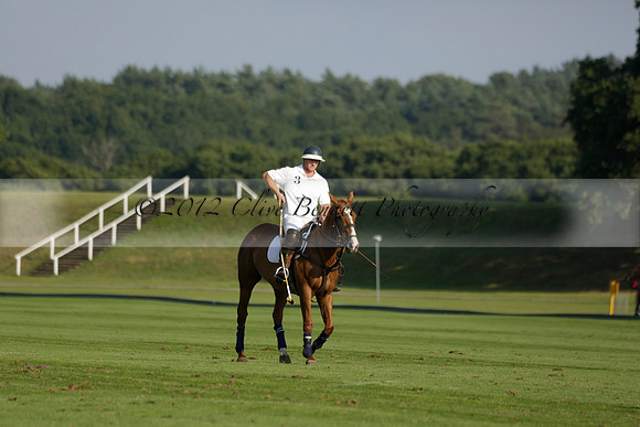 Pluma Negra (white) v Shoreline (black) in the Brecknock Cup Subsidiary final polo match played on Sunday 25 August 2013 at Cowdray Park Polo Club on Ambersham 1. 2013.10.12 www.polopictures.co.uk