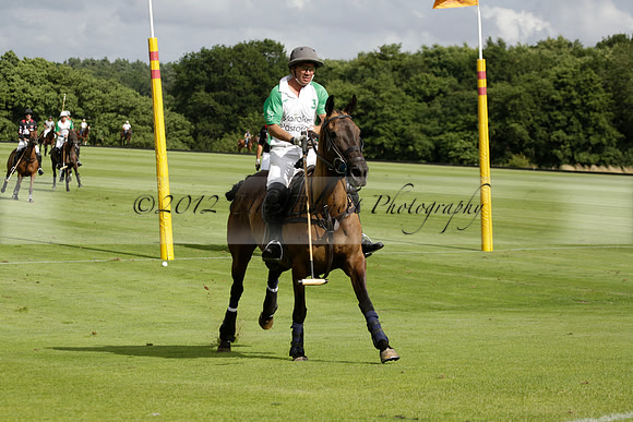 Jaeger Le Coultre (black)  v Wairakei Pastoral (white) in a Jaeger Le Coultre Holden White Cup polo match played on 29 July 2013 at Cowdray Park Polo Club on Brooksfieldwww.polopictures.co.uk