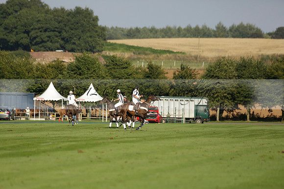 Pluma Negra (white) v Shoreline (black) in the Brecknock Cup Subsidiary final polo match played on Sunday 25 August 2013 at Cowdray Park Polo Club on Ambersham 1. 2013.10.12 www.polopictures.co.uk