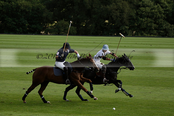 Pandas (white) v Home Farm (navy) in a Park House West Sussex Cup Polo match on Brooksfield at Cowdray Park Polo Club on Friday 30 August 2013. 2013.08.30 www.polopictures.co.uk