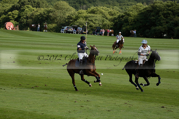 Pandas (white) v Home Farm (navy) in a Park House West Sussex Cup Polo match on Brooksfield at Cowdray Park Polo Club on Friday 30 August 2013. 2013.08.30 www.polopictures.co.uk