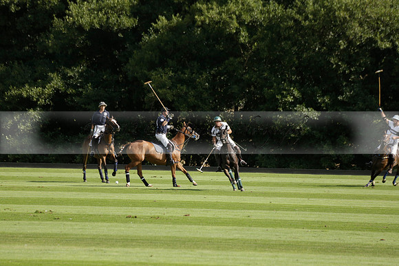 Pandas (white) v Home Farm (navy) in a Park House West Sussex Cup Polo match on Brooksfield at Cowdray Park Polo Club on Friday 30 August 2013. 2013.08.30 www.polopictures.co.uk