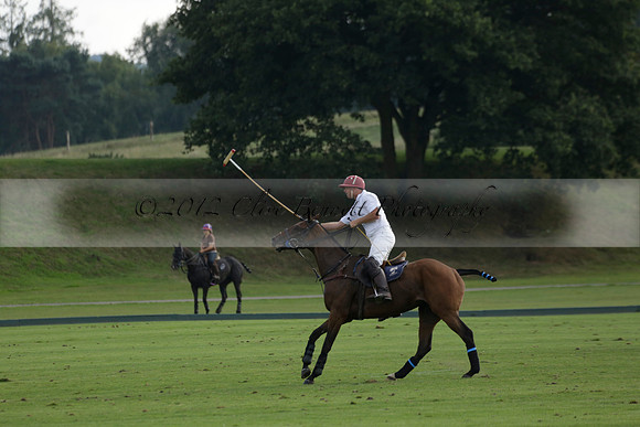 Pluma Negra (white) v Shoreline (black) in the Brecknock Cup Subsidiary final polo match played on Sunday 25 August 2013 at Cowdray Park Polo Club on Ambersham 1. 2013.10.12 www.polopictures.co.uk