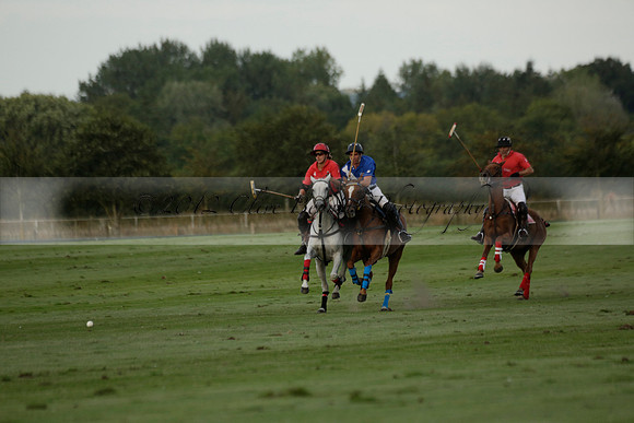 Ghost Chilli (blue) v Team Tonic (red) in a Lodsworth Cup Polo match on Ambersham 3 at Cowdray Park Polo Club on Friday 30 August 2013. 2013.08.30 www.polopictures.co.uk