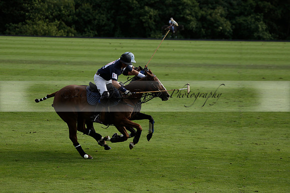 Pandas (white) v Home Farm (navy) in a Park House West Sussex Cup Polo match on Brooksfield at Cowdray Park Polo Club on Friday 30 August 2013. 2013.08.30 www.polopictures.co.uk
