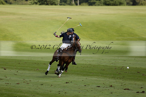 Pandas (white) v Home Farm (navy) in a Park House West Sussex Cup Polo match on Brooksfield at Cowdray Park Polo Club on Friday 30 August 2013. 2013.08.30 www.polopictures.co.uk
