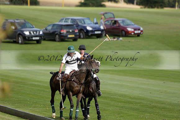 Pandas (white) v Home Farm (navy) in a Park House West Sussex Cup Polo match on Brooksfield at Cowdray Park Polo Club on Friday 30 August 2013. 2013.08.30 www.polopictures.co.uk